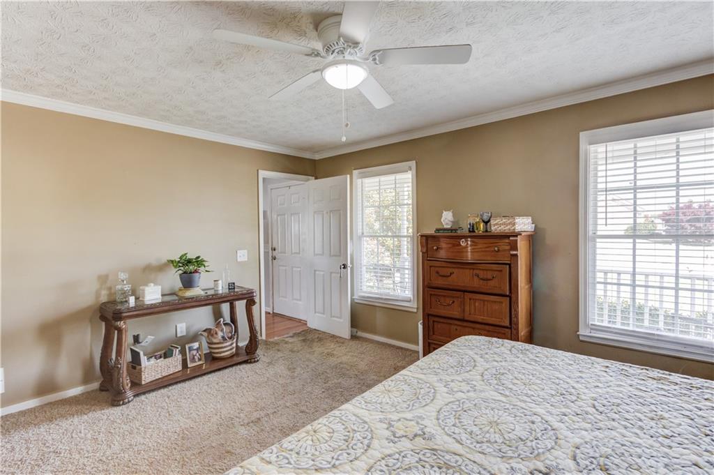 204 Angie Way Bethlehem, GA 30620 - Photo 19 of 42 a bedroom with furniture and a window