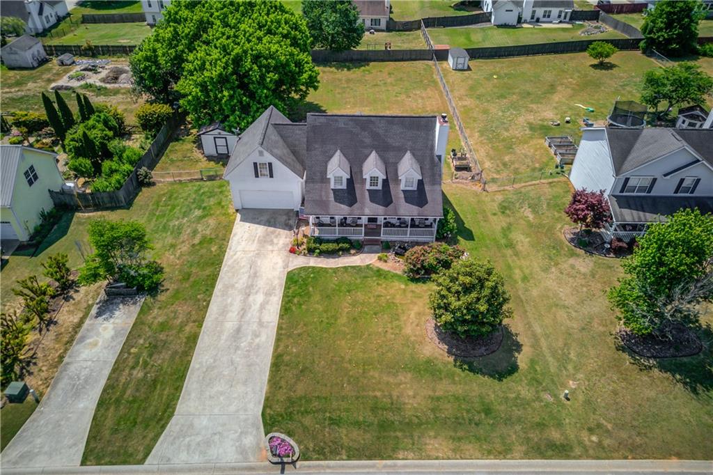 204 Angie Way Bethlehem, GA 30620 - Photo 2 of 42 an aerial view of a house with a garden and lake view