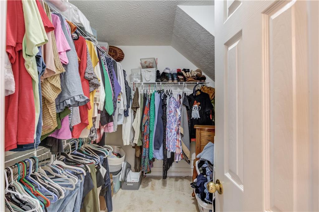 204 Angie Way Bethlehem, GA 30620 - Photo 23 of 42 a view of walk in closet with clothes