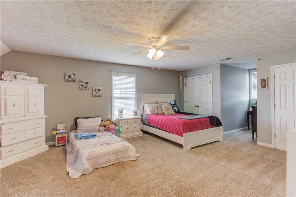 204 Angie Way Bethlehem, GA 30620 - Photo 26 of 42 a bedroom with a bed and window