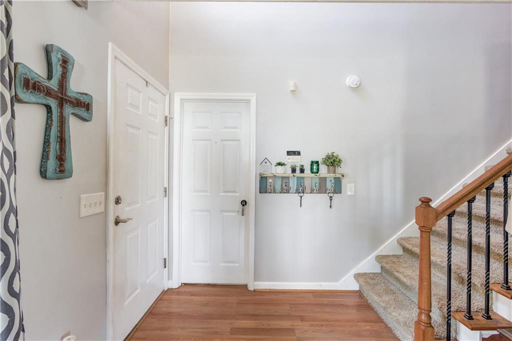 204 Angie Way Bethlehem, GA 30620 - Photo 7 of 42 a view of a hallway with wooden floor and staircase