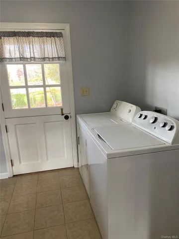 a utility room with dryer and washer