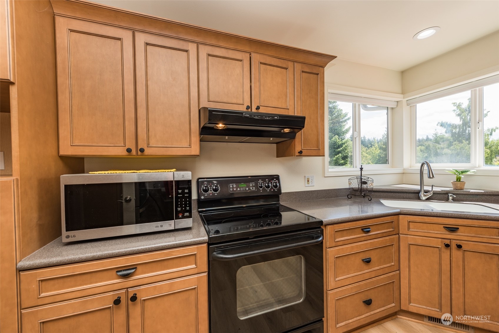 322 Ridge View Drive Sequim, WA 98382 - Photo 12 of 40 a kitchen with granite countertop cabinets stainless steel appliances and a window