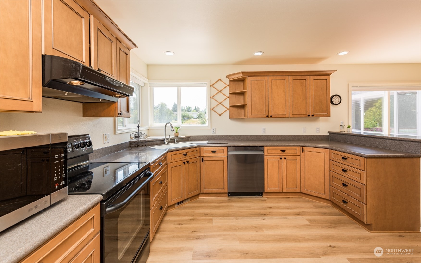 322 Ridge View Drive Sequim, WA 98382 - Photo 13 of 40 a kitchen with stainless steel appliances granite countertop a sink stove and granite counter top