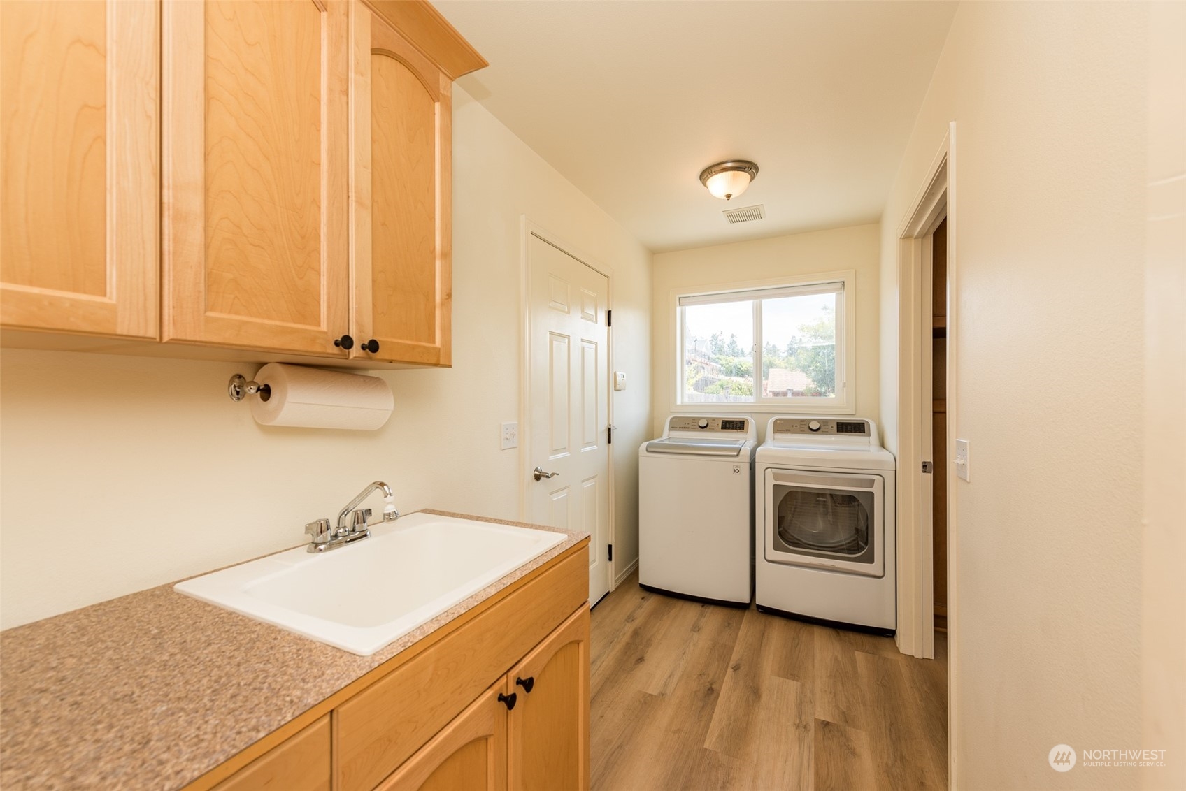 322 Ridge View Drive Sequim, WA 98382 - Photo 14 of 40 a view of a kitchen with sink and washer dryer