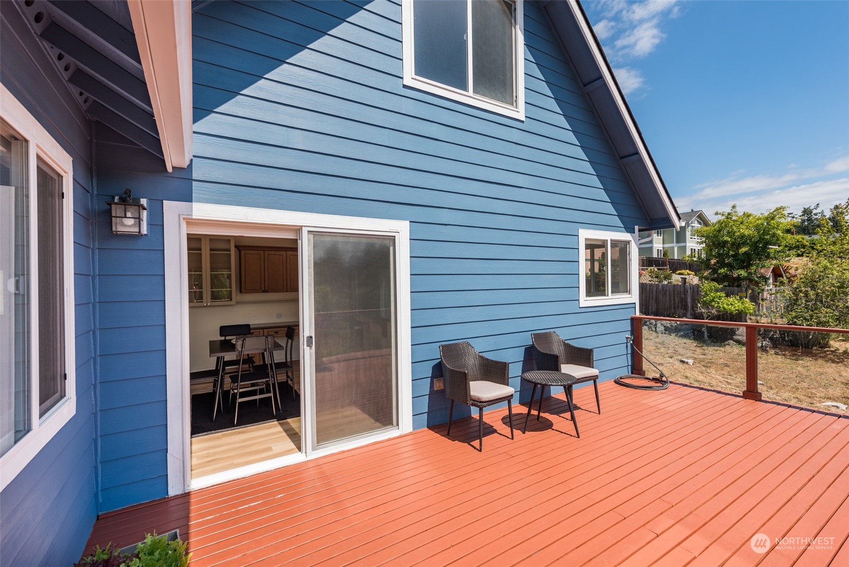 322 Ridge View Drive Sequim, WA 98382 - Photo 18 of 40 a view of a patio with table and chairs and wooden floor