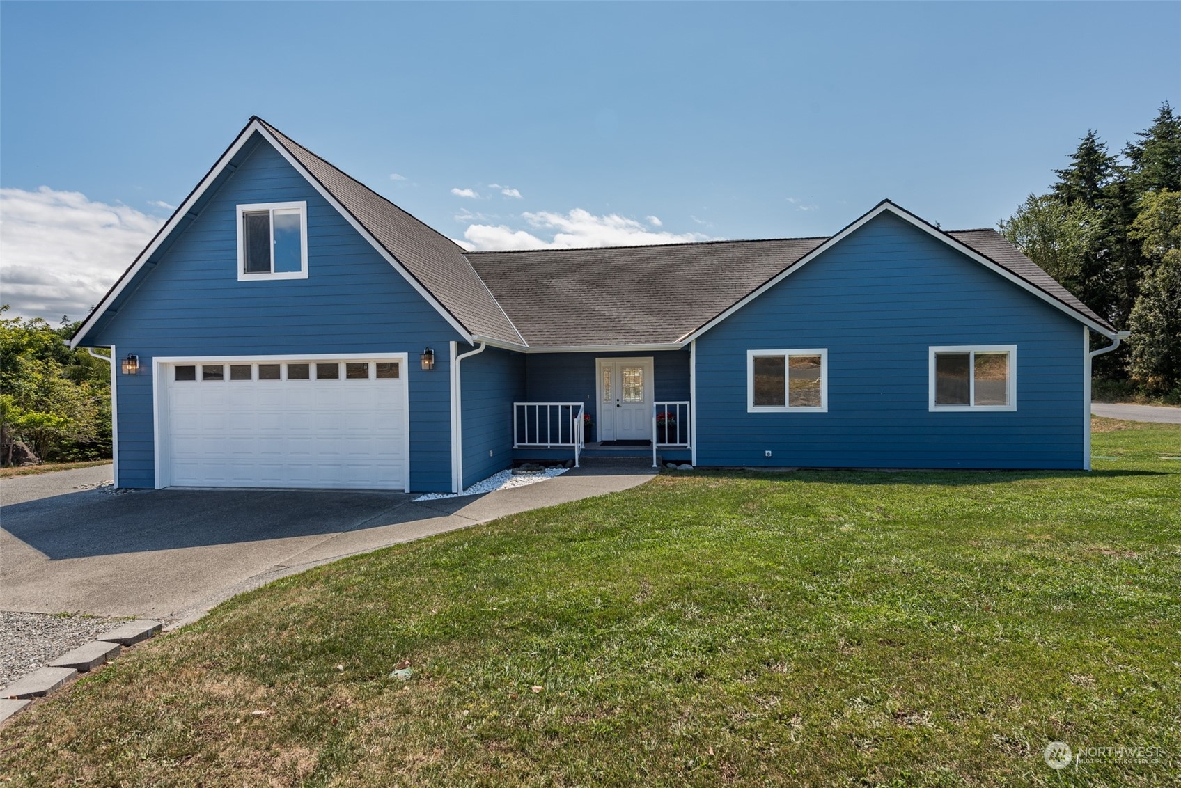 322 Ridge View Drive Sequim, WA 98382 - Photo 2 of 40 a front view of a house with a yard and garage