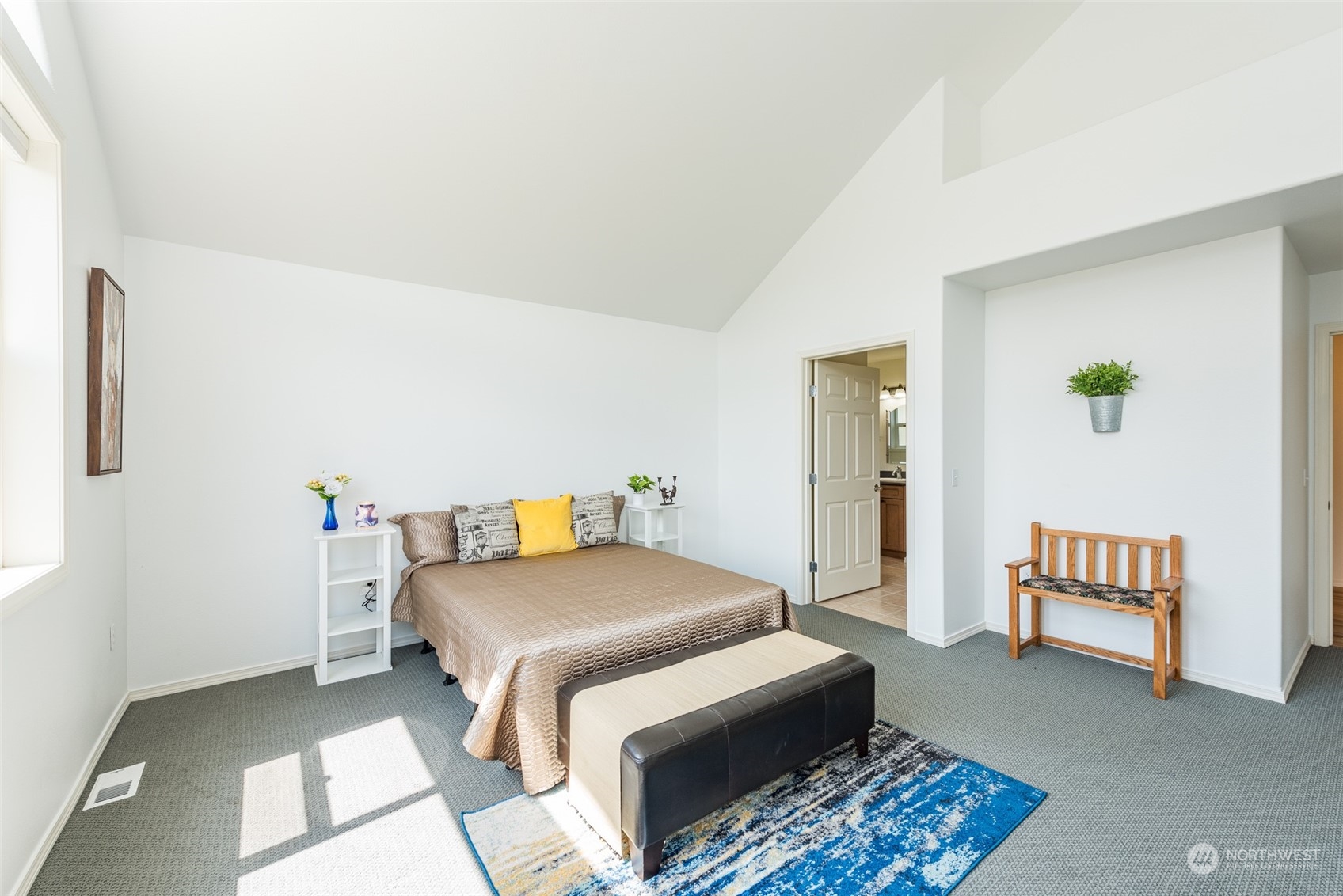 322 Ridge View Drive Sequim, WA 98382 - Photo 21 of 40 a bedroom with a bed and a table in it