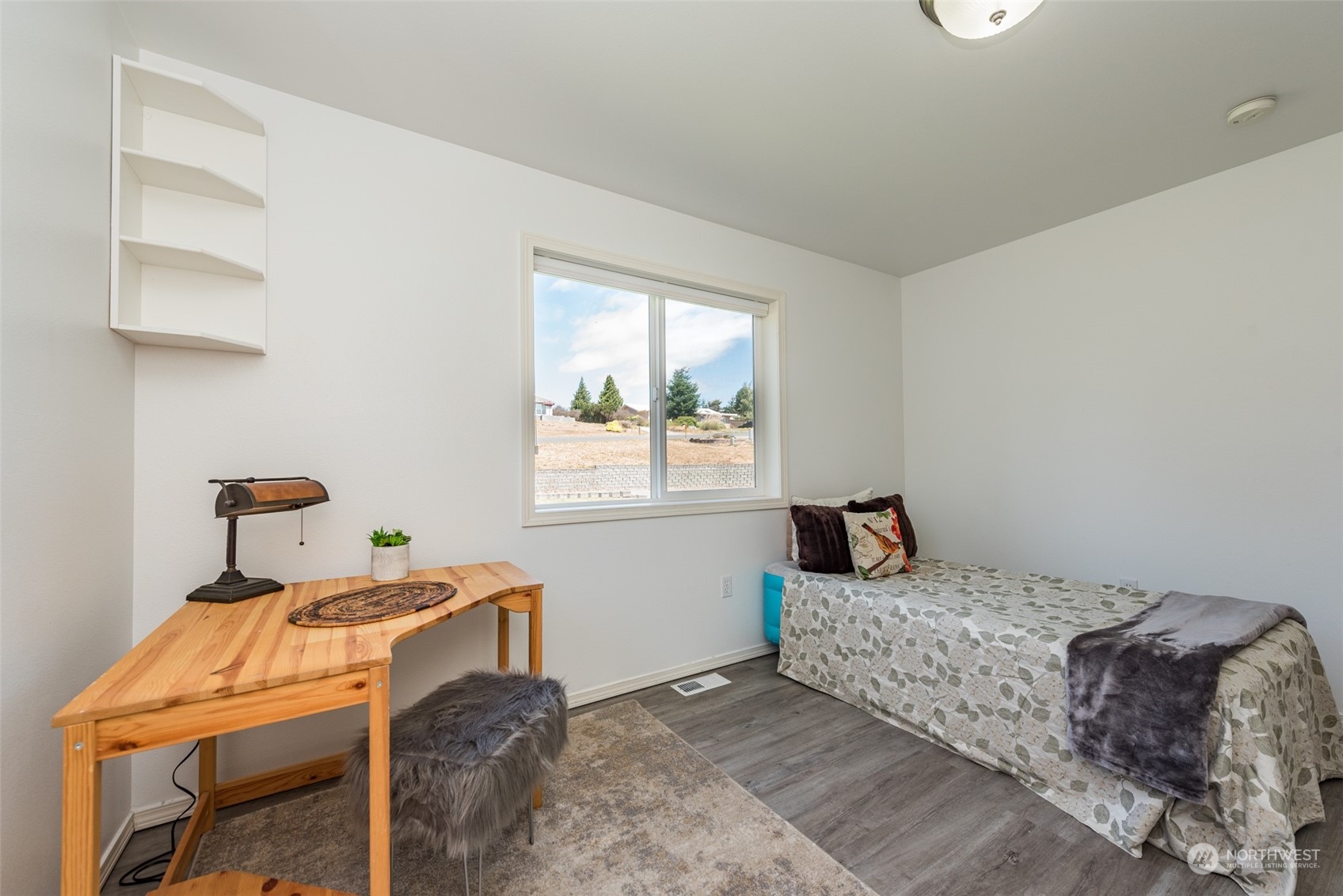 322 Ridge View Drive Sequim, WA 98382 - Photo 27 of 40 a bedroom with a bed and a window