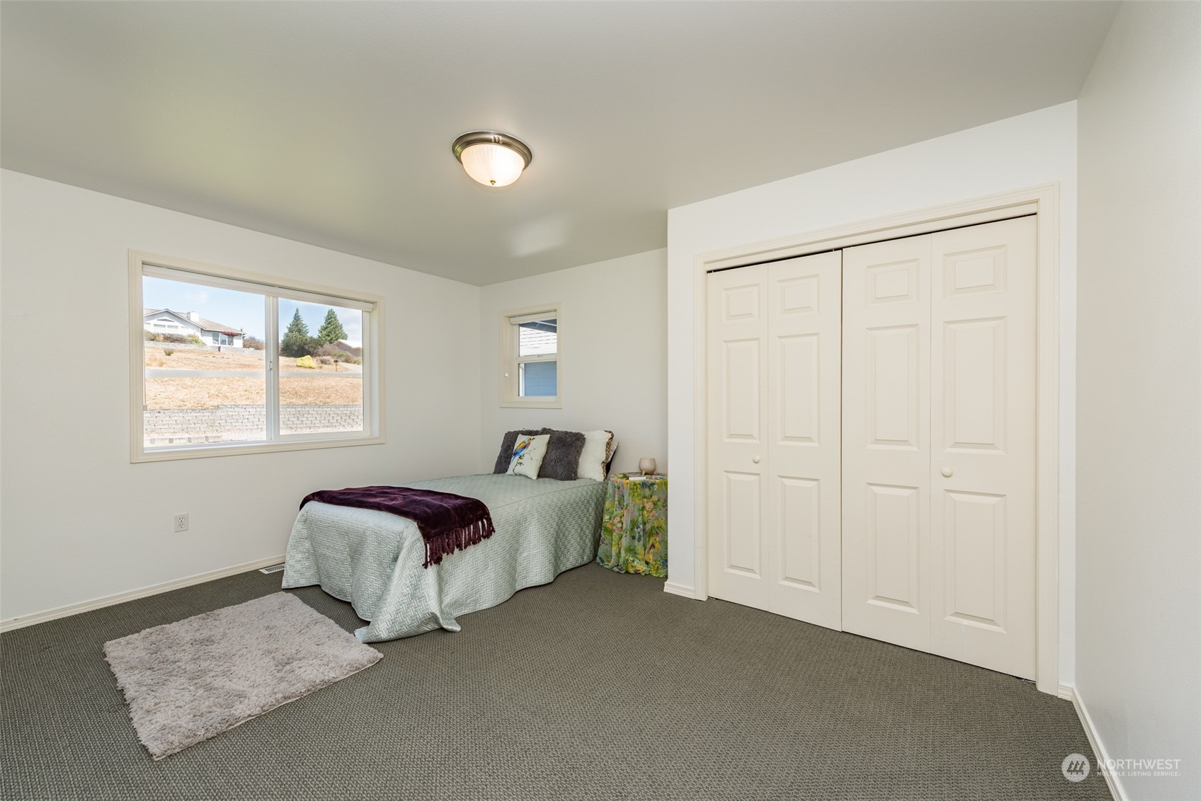 322 Ridge View Drive Sequim, WA 98382 - Photo 28 of 40 a living room with a bed furniture and a window