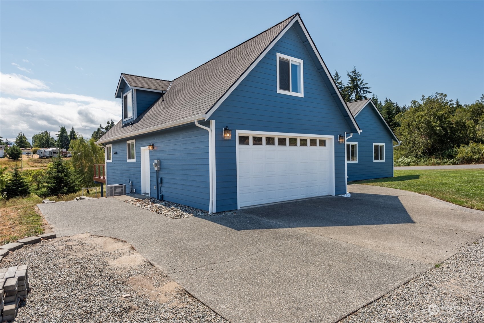 322 Ridge View Drive Sequim, WA 98382 - Photo 39 of 40 a front view of a house with a yard and garage