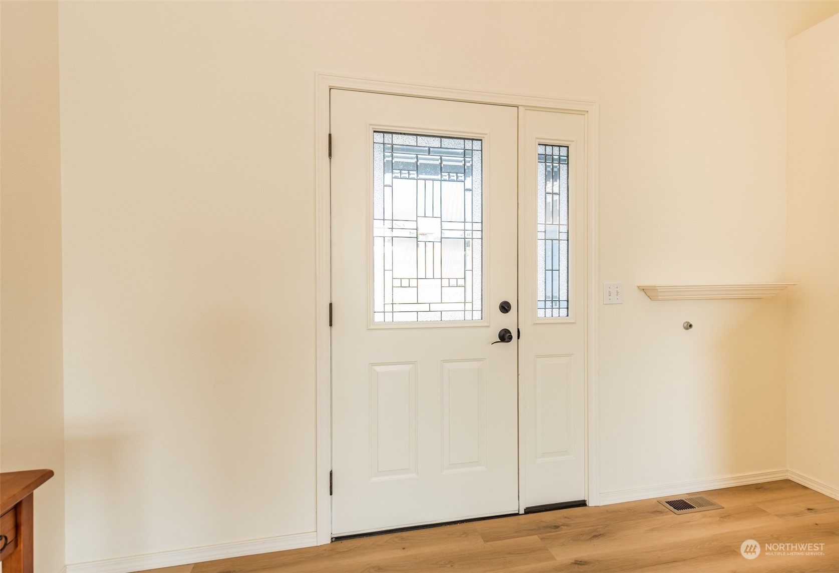 322 Ridge View Drive Sequim, WA 98382 - Photo 5 of 40 a view of an empty room with wooden floor and a window
