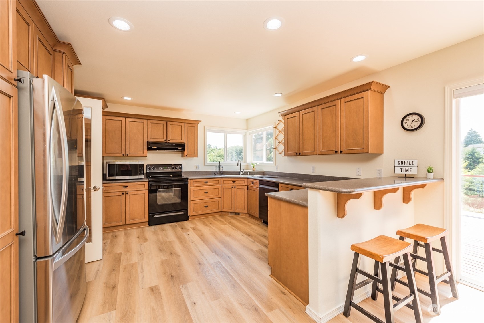 322 Ridge View Drive Sequim, WA 98382 - Photo 9 of 40 a kitchen with stainless steel appliances granite countertop a refrigerator and a stove top oven