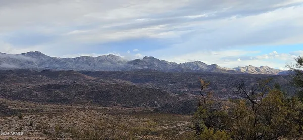 a view of a town with mountains in the background