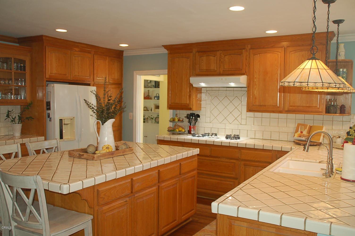 1644 Morada Place Altadena, CA 91001 - Photo 29 of 74 a kitchen with stainless steel appliances kitchen island granite countertop a sink and cabinets