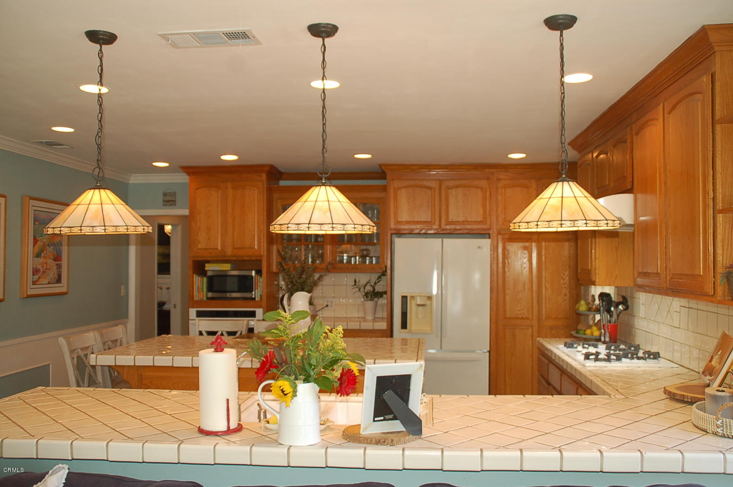 1644 Morada Place Altadena, CA 91001 - Photo 30 of 74 a room with lots of potted plants and open kitchen view