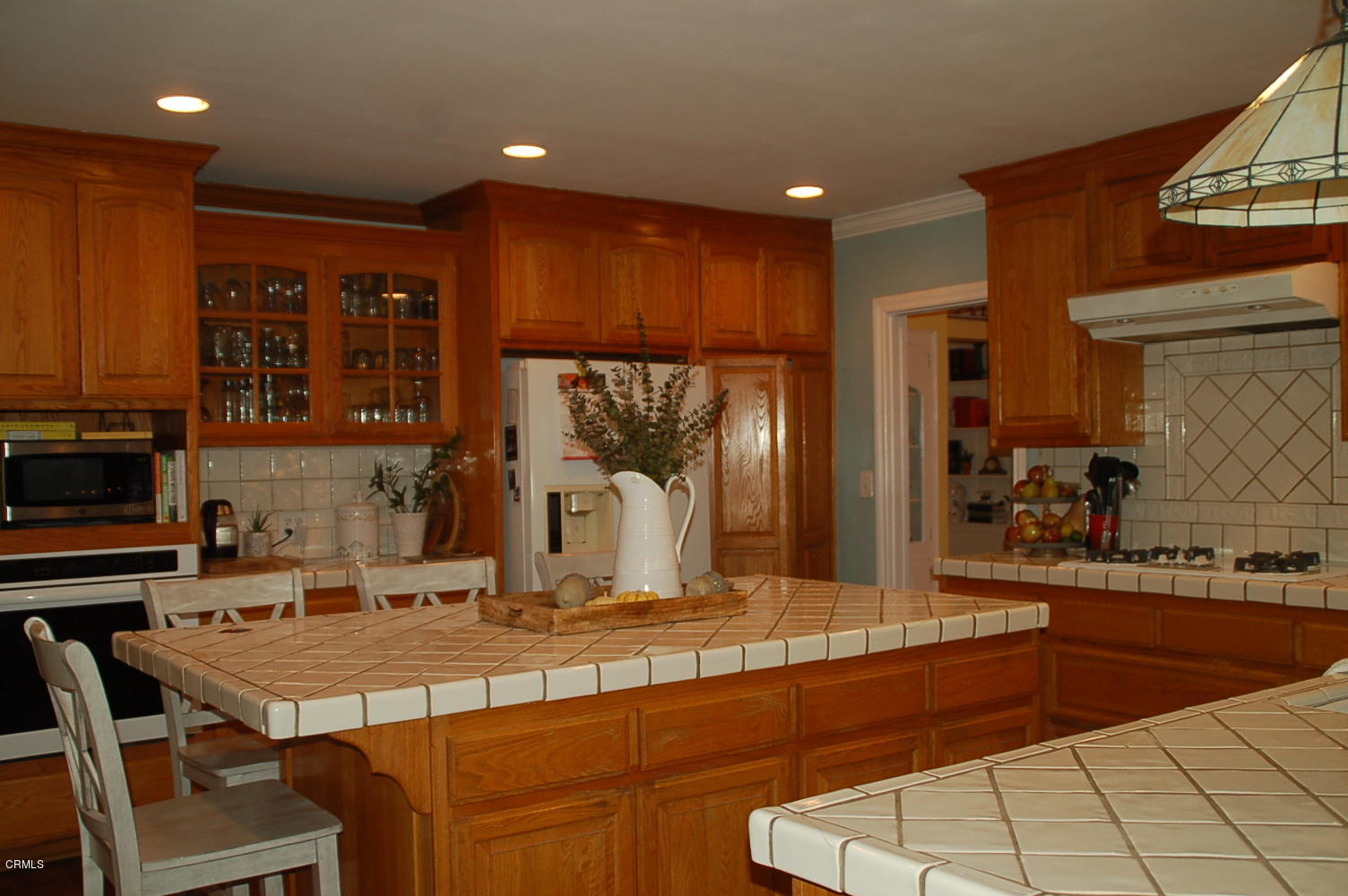 1644 Morada Place Altadena, CA 91001 - Photo 35 of 74 a kitchen with stainless steel appliances kitchen island granite countertop a sink and cabinets