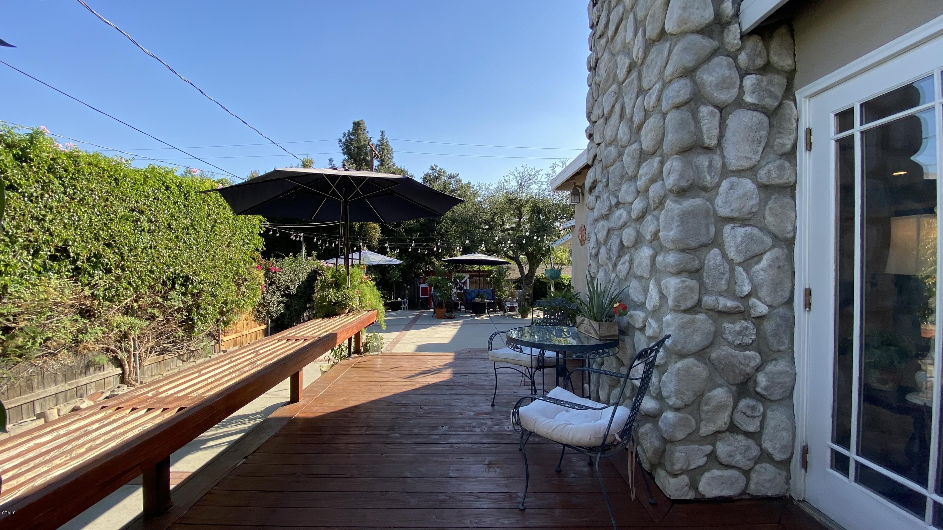 1644 Morada Place Altadena, CA 91001 - Photo 47 of 74 a view of a porch with furniture and a yard