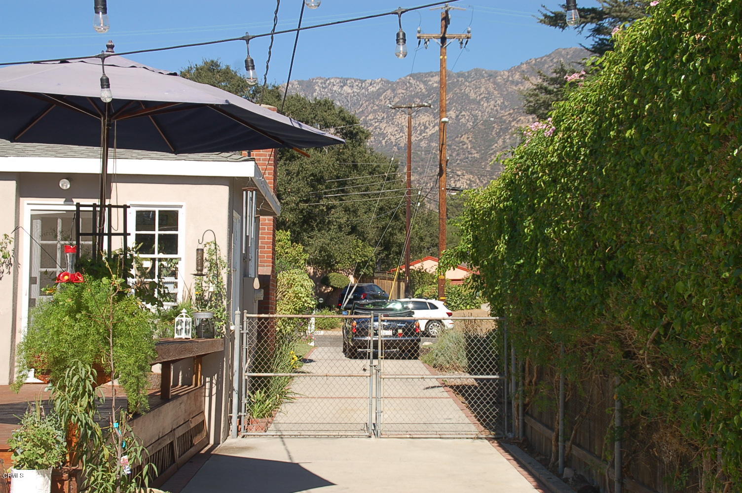 1644 Morada Place Altadena, CA 91001 - Photo 51 of 74 a view of a patio with table and chairs under an umbrella