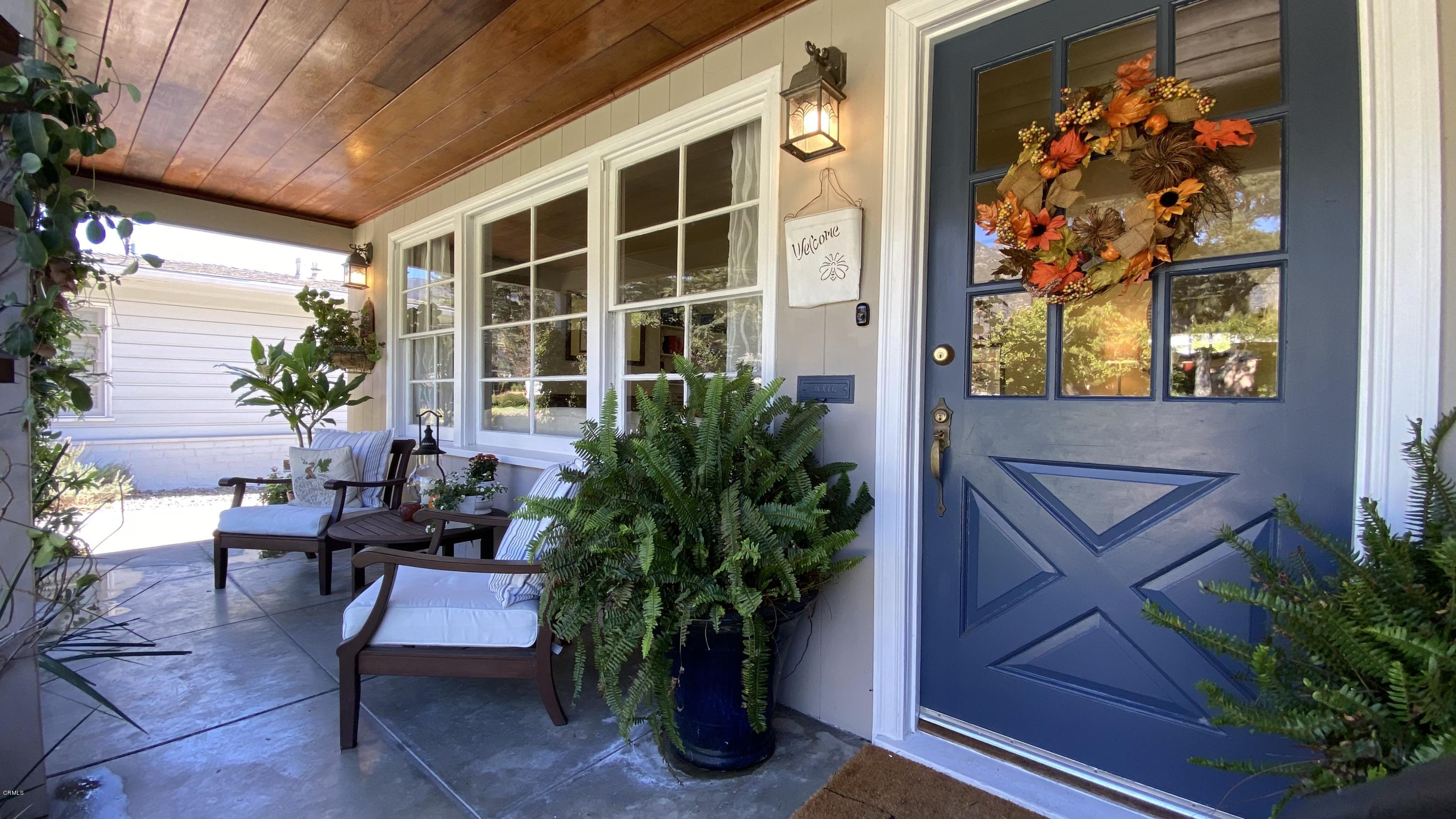 1644 Morada Place Altadena, CA 91001 - Photo 9 of 74 a view of a porch with chairs and potted plants