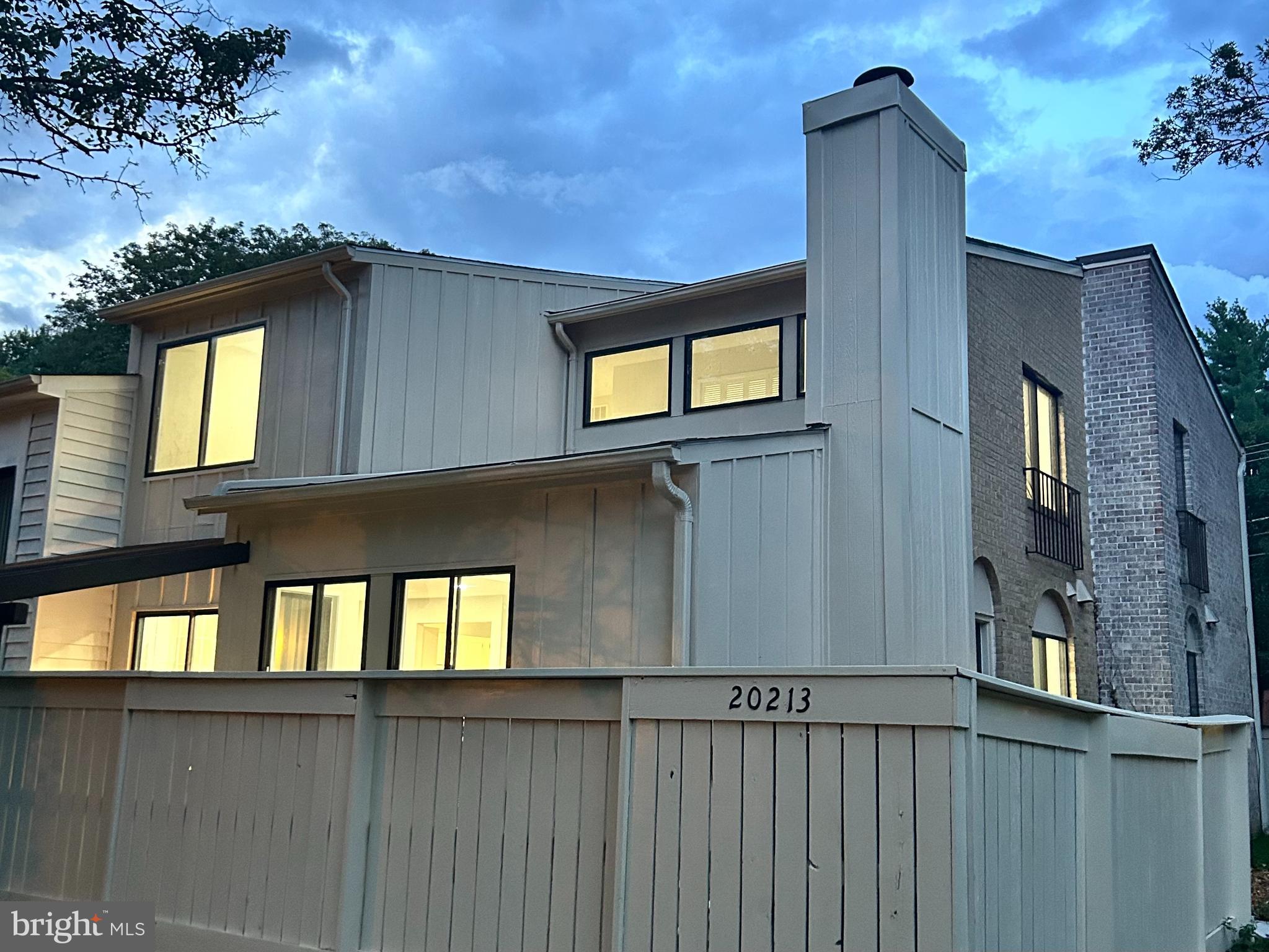 a view of windows and trees in the background