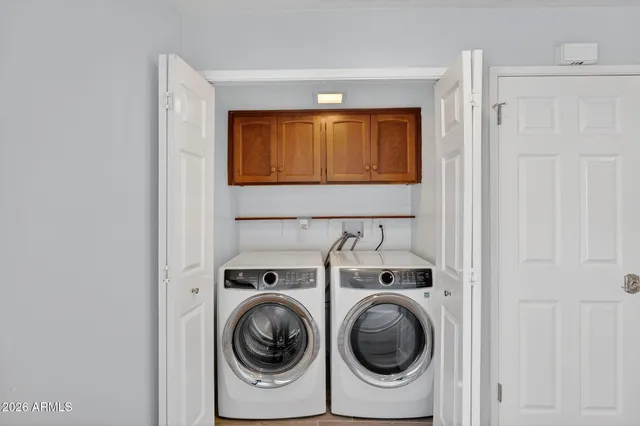 a view of a kitchen with wooden floor and a sink