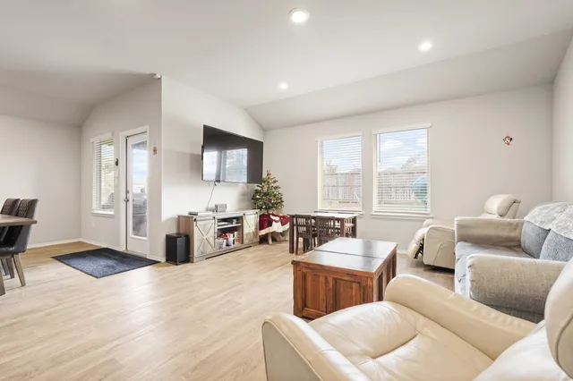 a bedroom with a bed chair and window