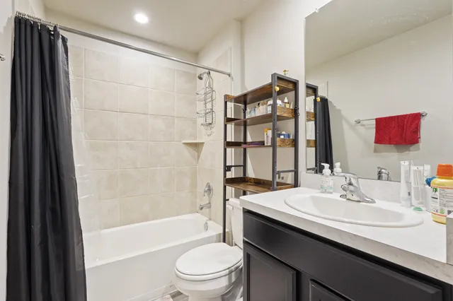 a bedroom with bed and a window