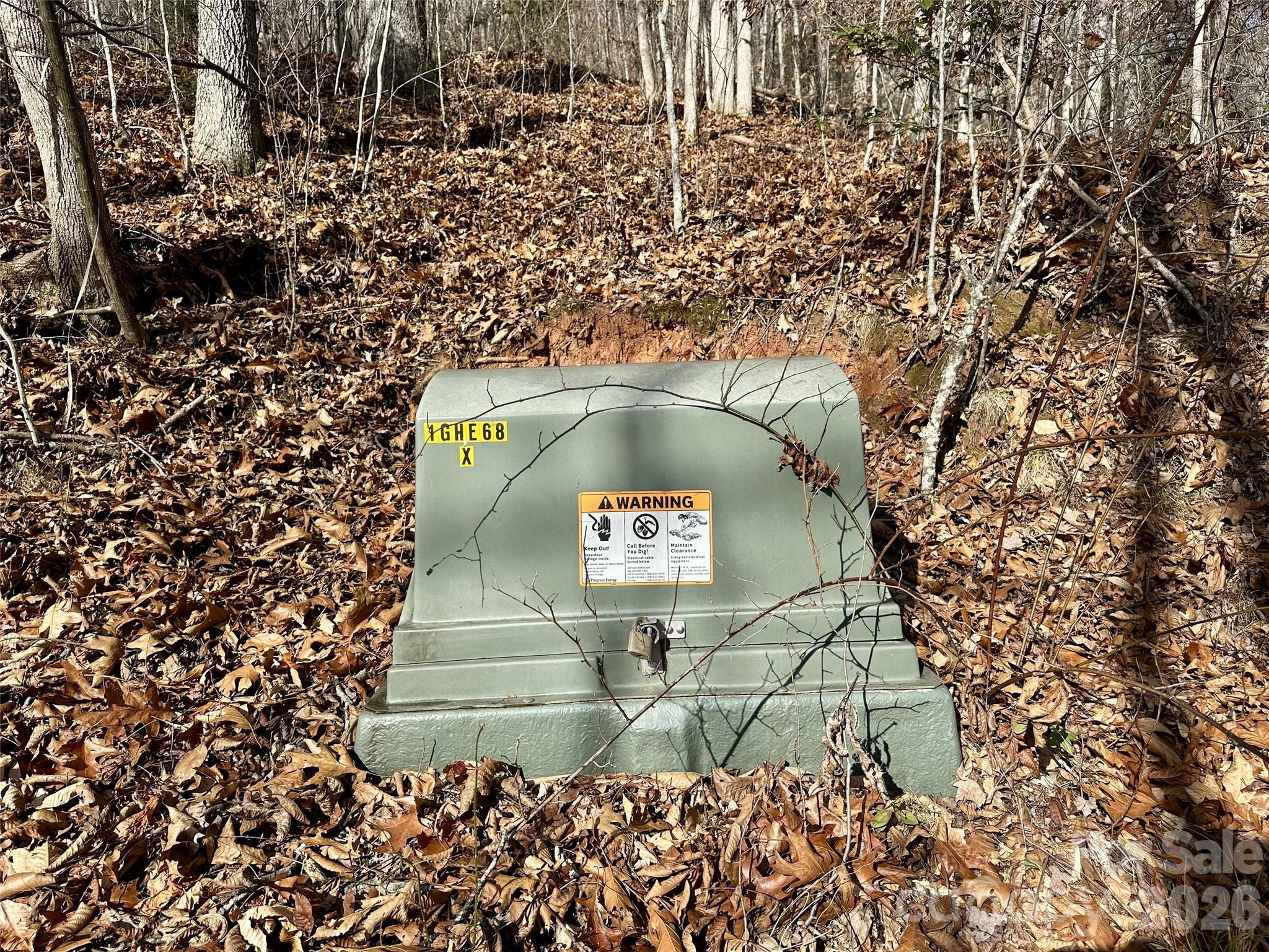 0 Queen Cove Road Waynesville, NC 28785 - Photo 8 of 17 a view of outdoor space with a garden and signage