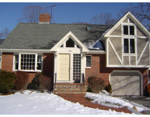 30 Abbott Road Wellesley, MA 02481 - Photo 2 of 17 a front view of a house with a yard