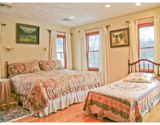 30 Abbott Road Wellesley, MA 02481 - Photo 10 of 17 a bedroom with a bed and wooden floor