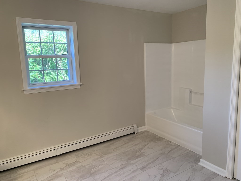 581 Warren Wright Road Belchertown, MA 01007 - Photo 16 of 25 an empty room with a window