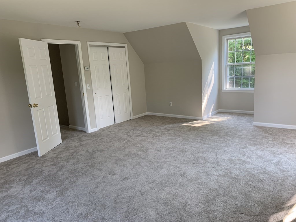 581 Warren Wright Road Belchertown, MA 01007 - Photo 17 of 25 an empty room with windows