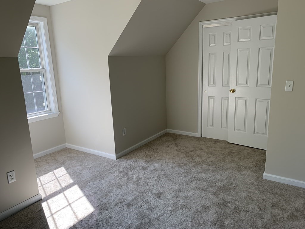 581 Warren Wright Road Belchertown, MA 01007 - Photo 19 of 25 an empty room with windows