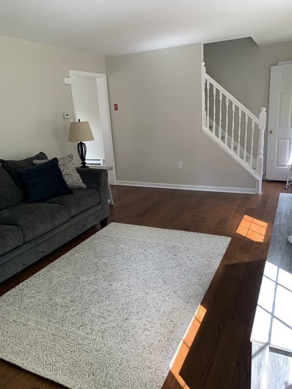581 Warren Wright Road Belchertown, MA 01007 - Photo 5 of 25 a living room with furniture and a window