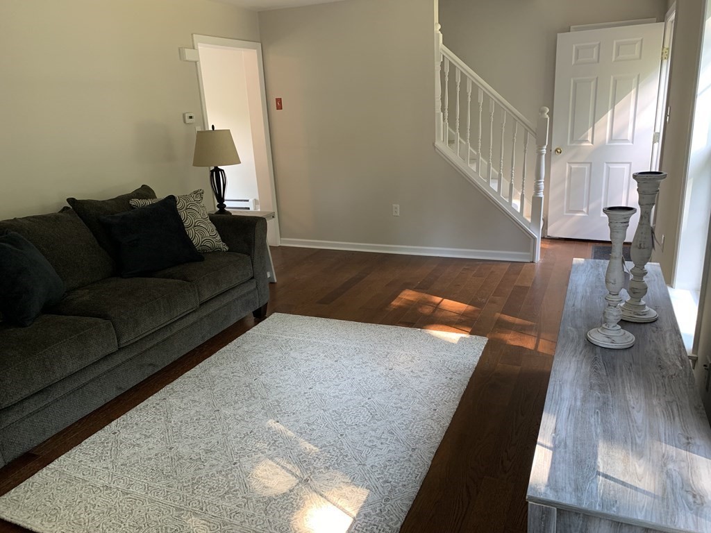 581 Warren Wright Road Belchertown, MA 01007 - Photo 6 of 25 a living room with couch and wooden floor