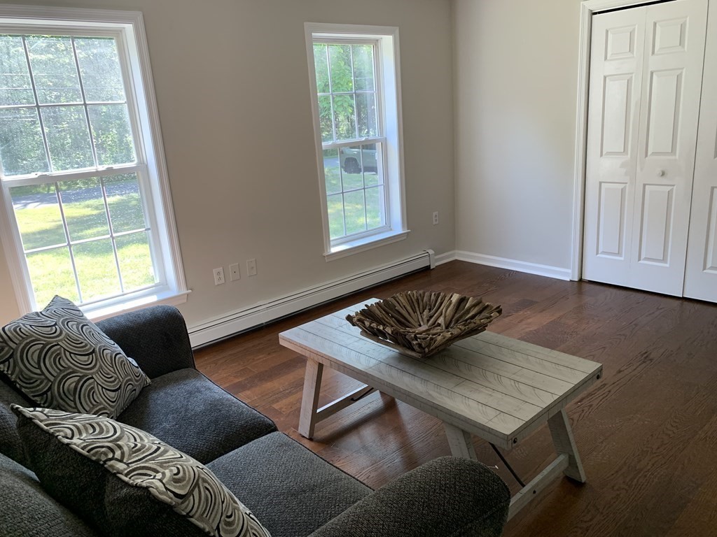 581 Warren Wright Road Belchertown, MA 01007 - Photo 8 of 25 a living room with furniture and a window