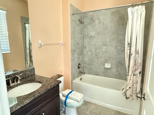 12590 Retreat Place Spring Hill, FL 34610 - Photo 19 of 33 a bathroom with a granite countertop sink toilet and shower