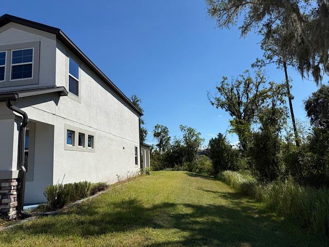 12590 Retreat Place Spring Hill, FL 34610 - Photo 2 of 33 a view of back yard of the house