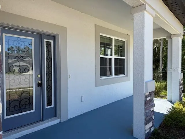 a view of house with backyard