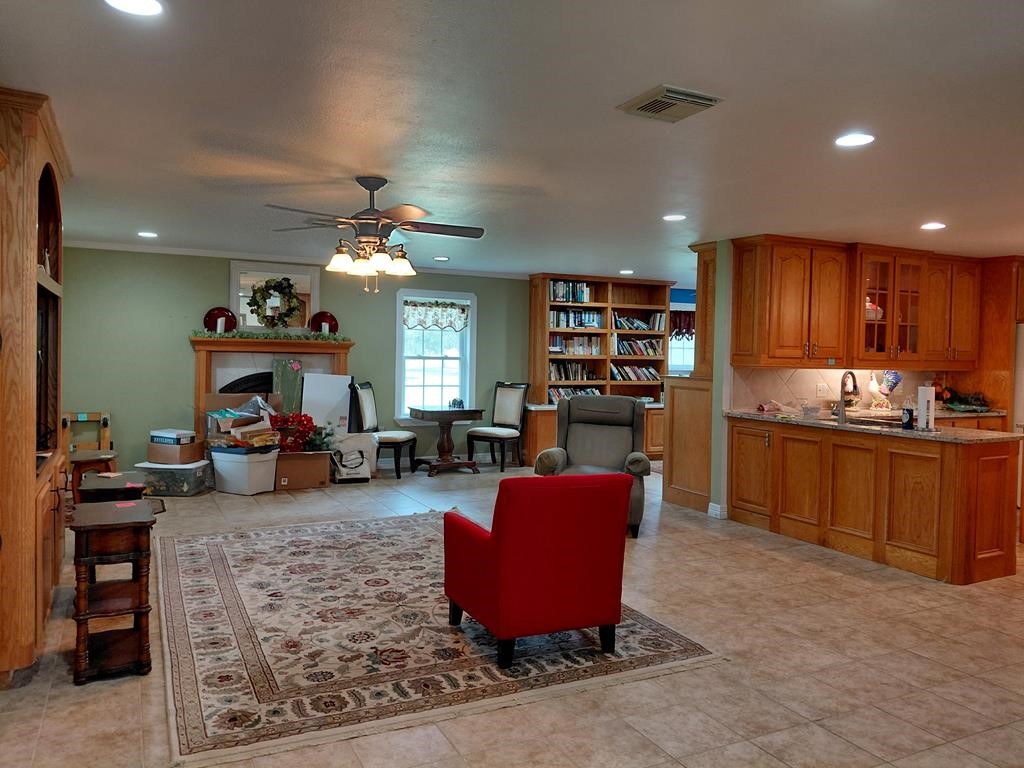 1231 County Road 201A Angleton, TX 77515 - Photo 25 of 26 a living room with furniture and a kitchen view