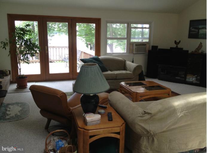 232 River Road Chestertown, MD 21620 - Photo 11 of 23 Main floor LR french doors to deck and river