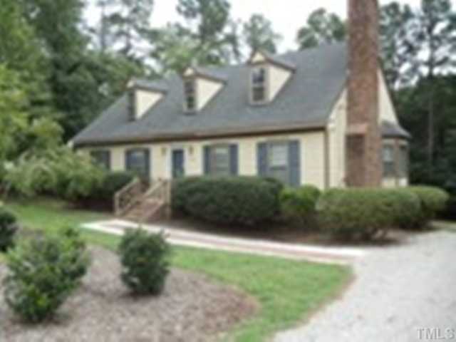 3220 Greenville Loop Road Wake Forest, NC 27587 - Photo 1 of 8 Awesome landscaping with walkway and bushes that have been well maintained.