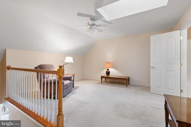 a bedroom with furniture and white walls
