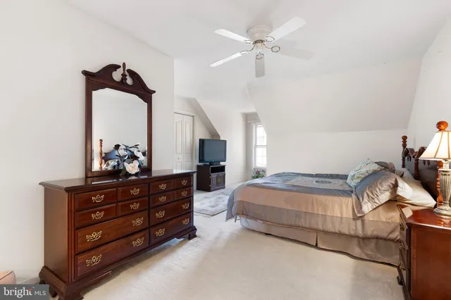 a bedroom with bed and window