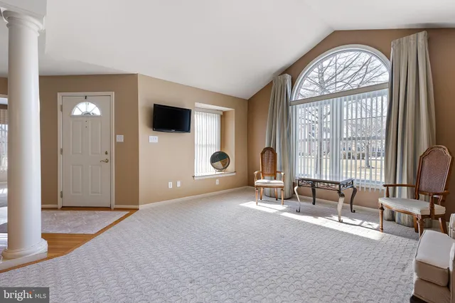 a view of a livingroom with a large window and couch