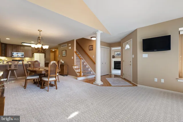a view of a livingroom with furniture and a flat screen tv