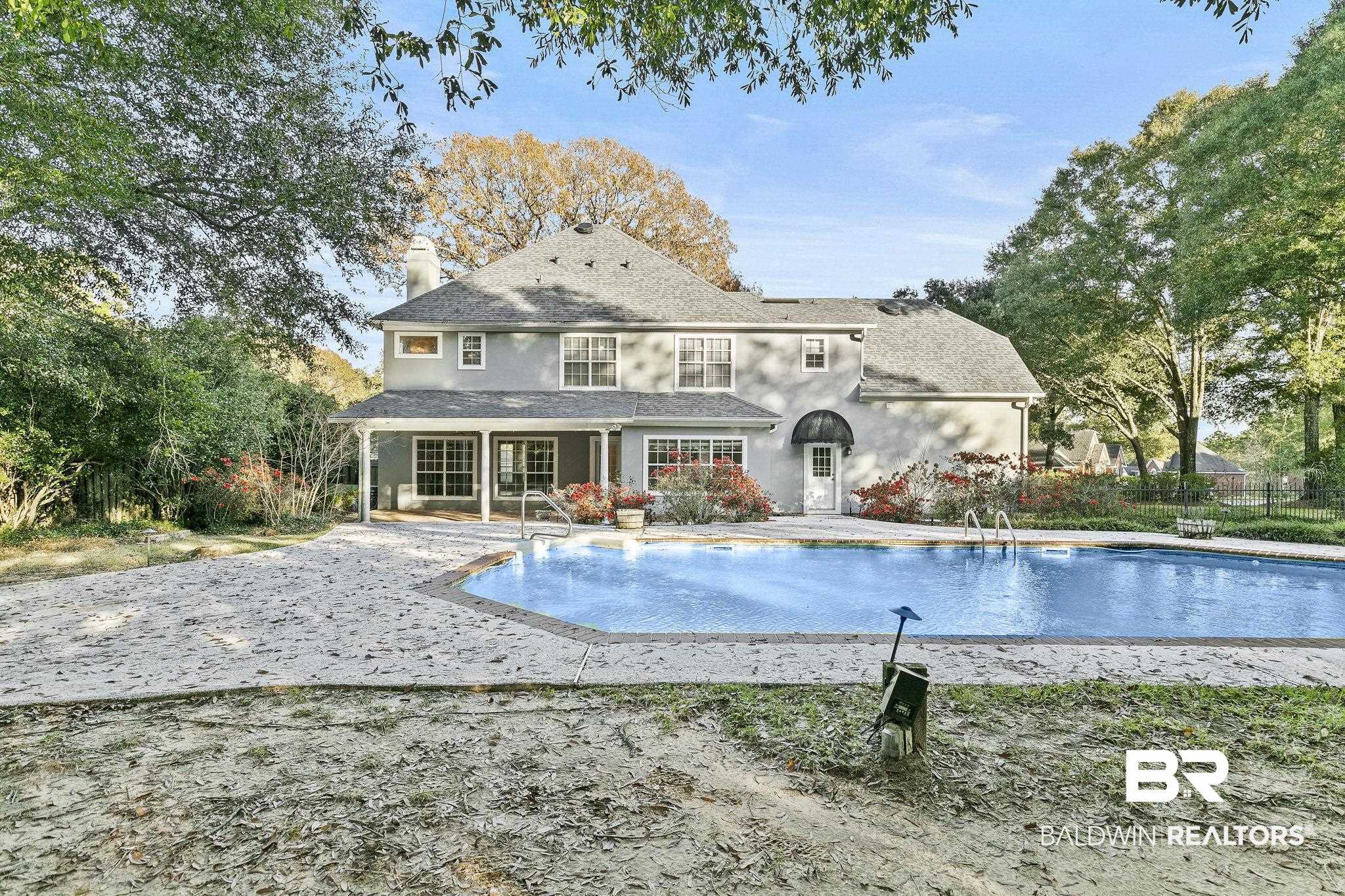 2100 Stonebrook Drive West Mobile, AL 36695 - Photo 46 of 60 Back of property with a patio and a fenced in pool