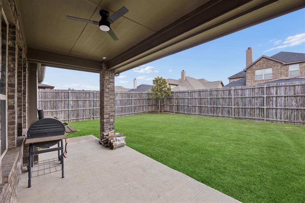 1014 Dunhill Lane Forney, TX 75126 - Photo 29 of 38 Covered back porch with a fan.
