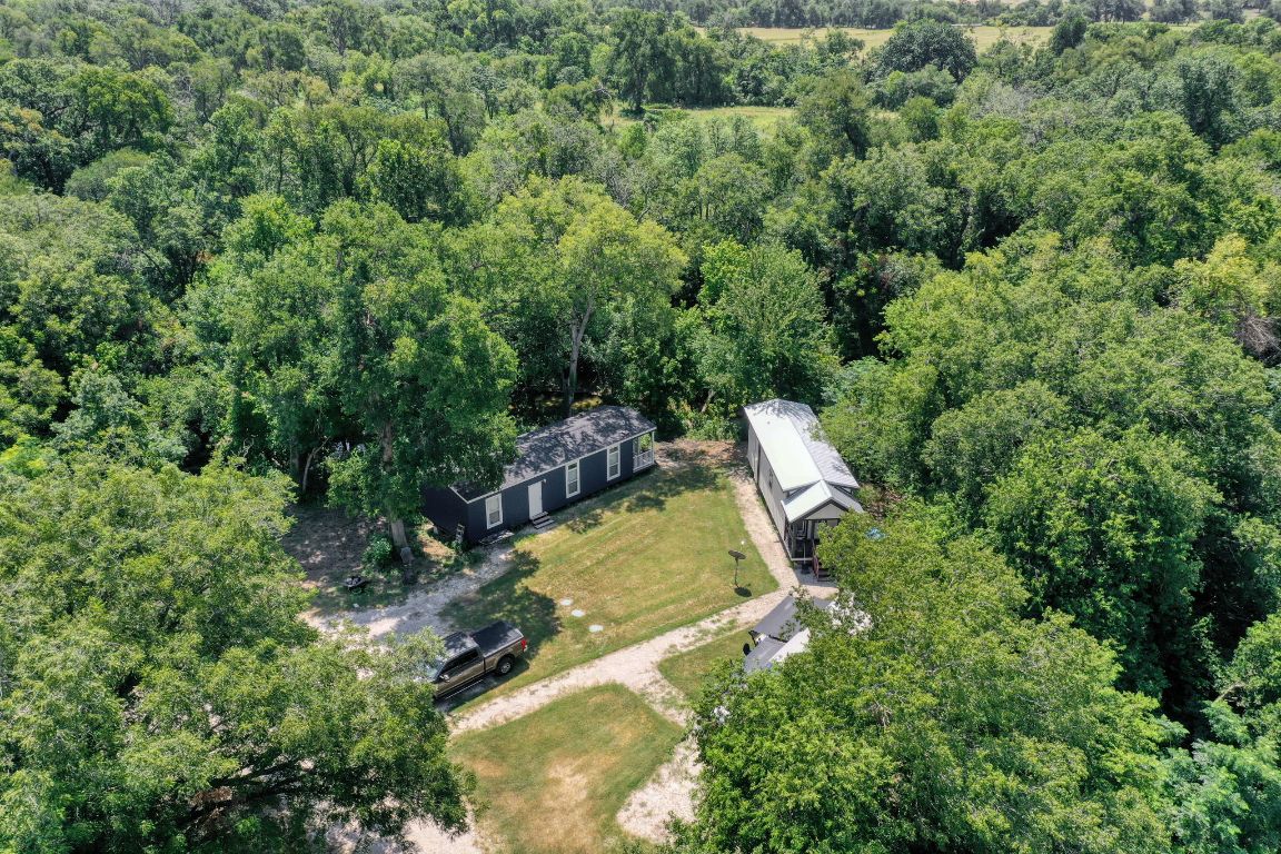 1660 South FM 1660 Taylor, TX 76574 - Photo 11 of 25 an aerial view of a house with a yard and swimming pool